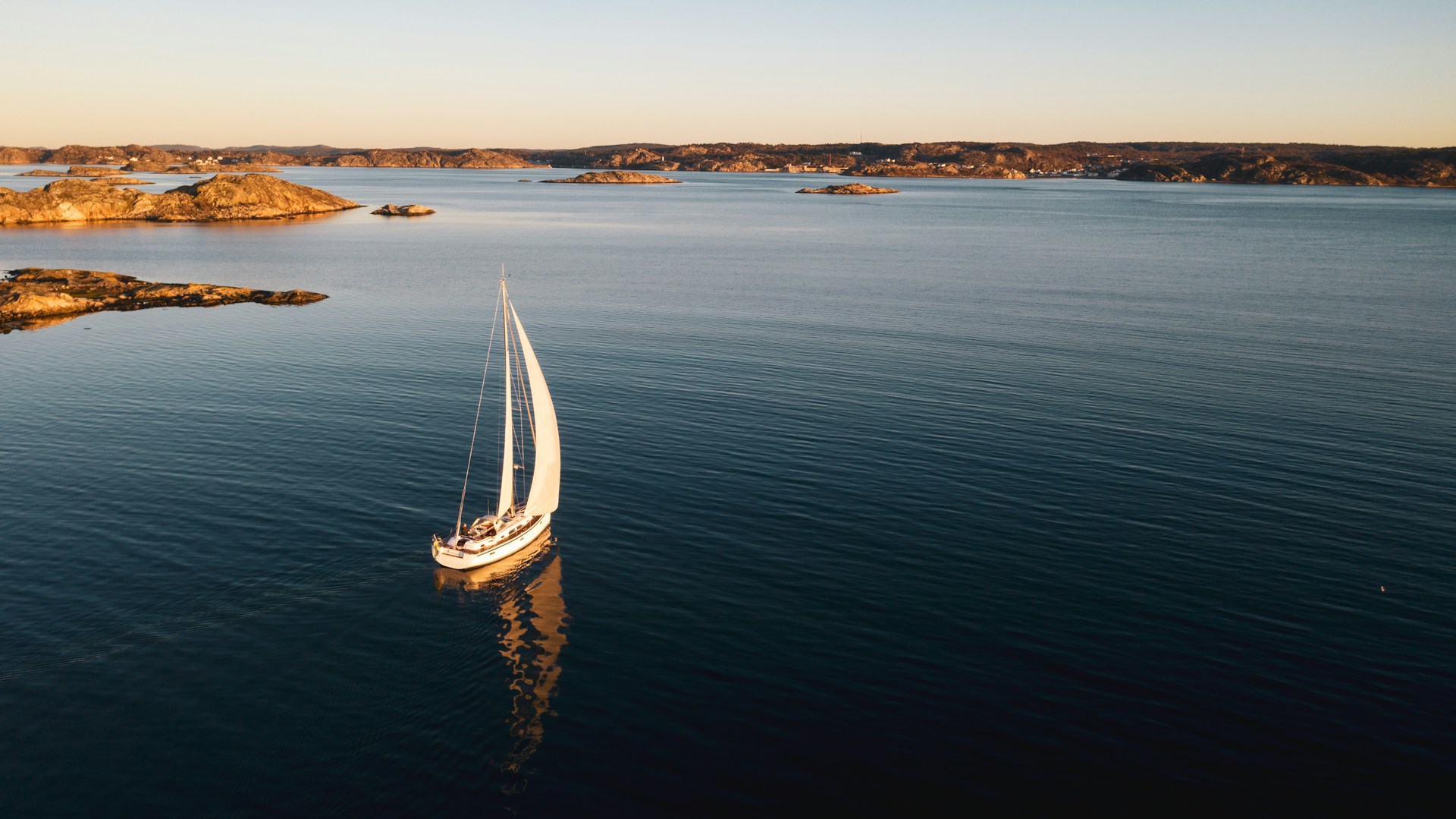 Operations & Logistics - Elegant sailing yacht navigating the fjords of Norway, offering a unique Nordic adventure with Swisspath Yachting in Scandinavia’s breathtaking waters.